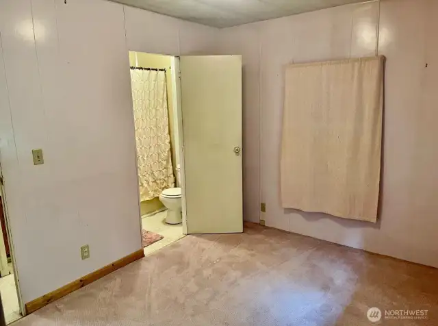Bedroom looking into bathroom