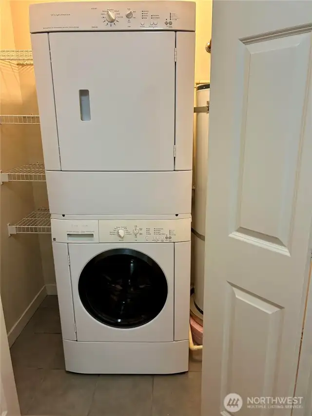 Washer dryer and hot water tank in unit.