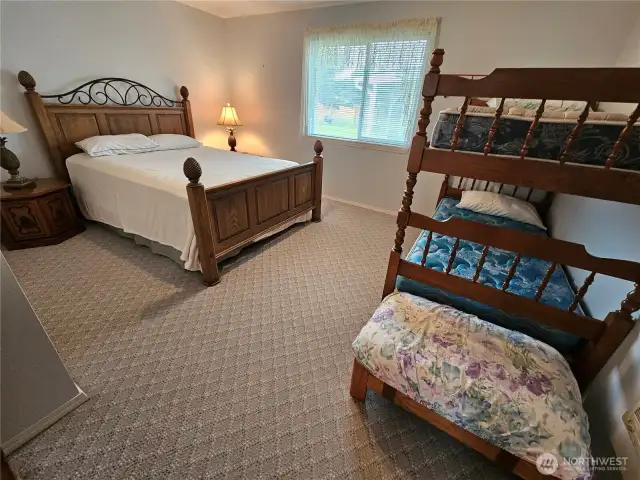 Guest bedroom sleeps several people.