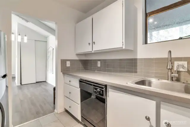 Remodeled kitchen, New granite countertops, and tile flooring.