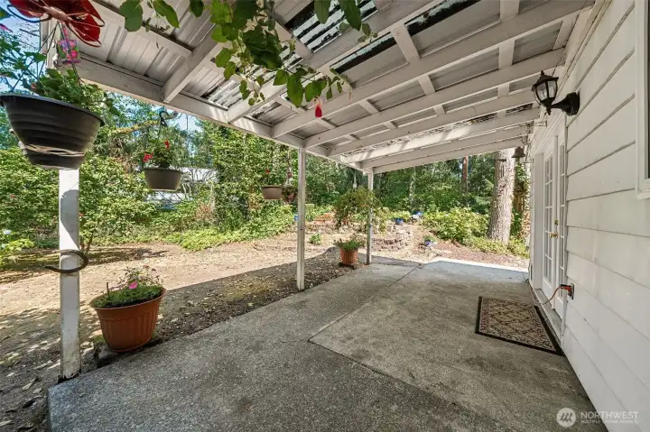 Another view of the space.  Yard is maintained by the HOA but homeowner has an opportunity to get creative with  potted garden.