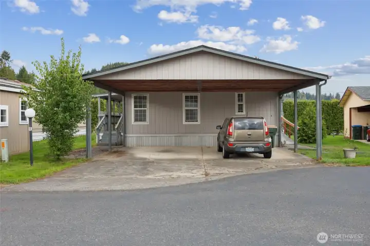Carport with 2 spaces- the car is gone now.