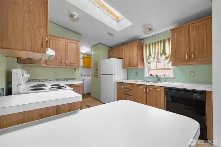 Looking through the kitchen to the utility room. Everything is clean and ready to go!