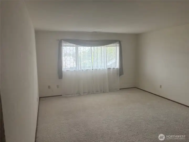 Large bedroom with plenty of daylight.