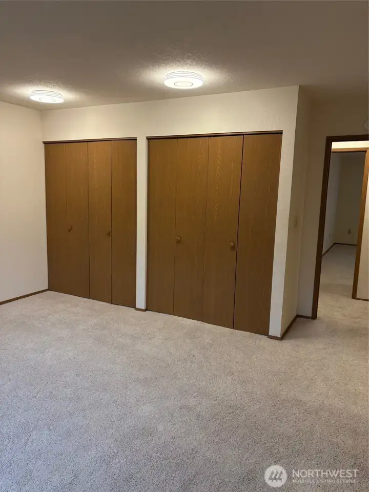 Primary bedroom with two good size closets.