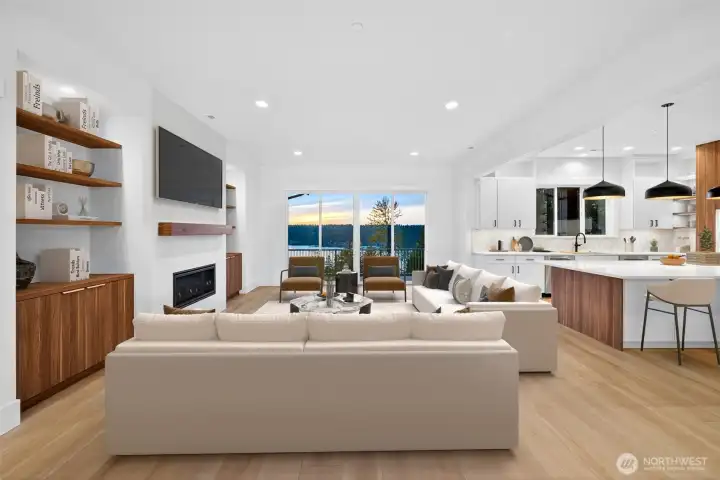 Large living room seemlislsy flows from both formal dinning room and the kitchen.