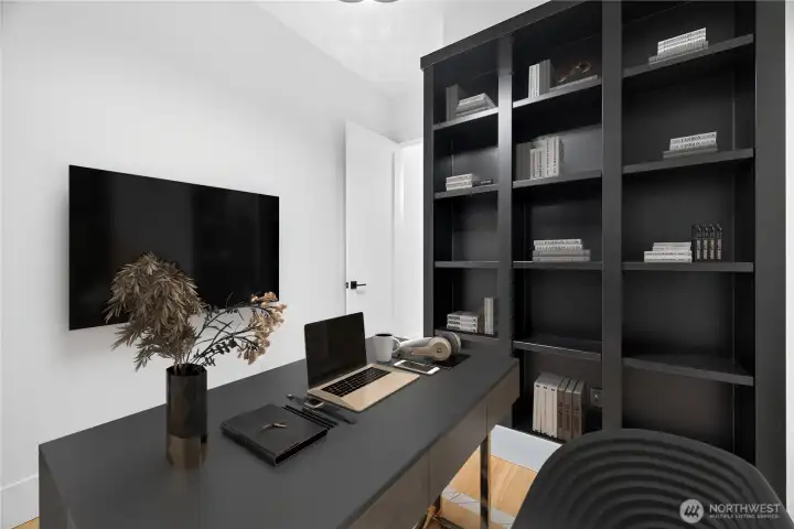 Abundant natural light fills the private office/library/flex space, complete with built-in bookshelves for storage or displaying books, collectibles, and decor.