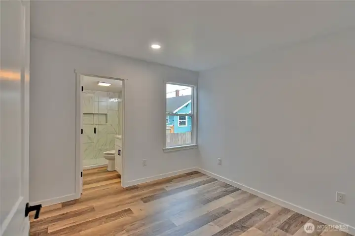 Primary bedroom toward its bathroom
