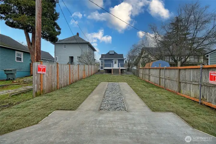 Spacious fenced back yard with lots of parking
