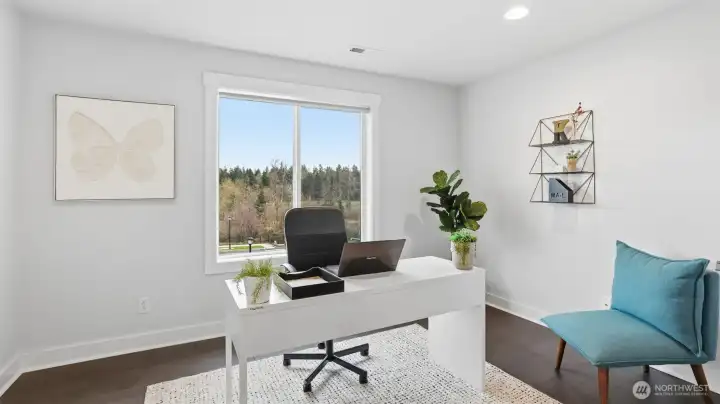 Beautifully appointed flex room, staged as a serene and functional home office