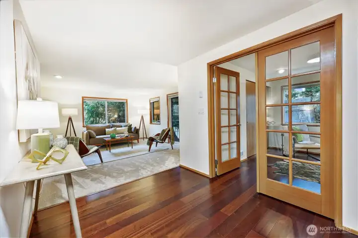 Reclaimed engineered hardwoods flow from the entry to the kitchen & dining area - and the 2nd bedroom that is setup as an office.