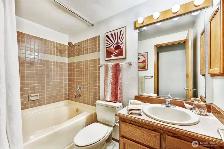 Hallway bath with soaking tub.