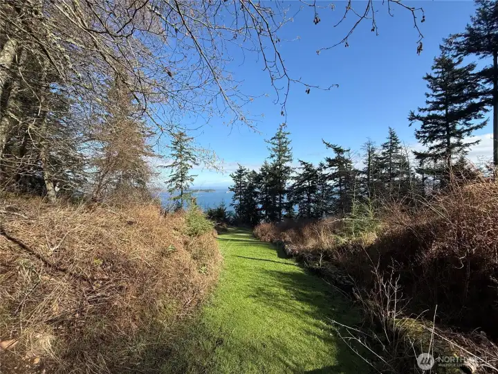 Gently sloping grassy access path to the Community beach