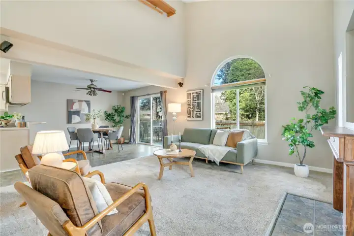 Vaulted Ceilings and beautiful windows bring in the greenery and natural light.  Flow from the living room, to the dining and family area, to the kitchen!