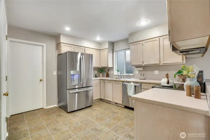 This kitchen has newer appliances and a pantry closet.  Access to the mudroom where you'll find storage, washer dryer and access to the two car garage.