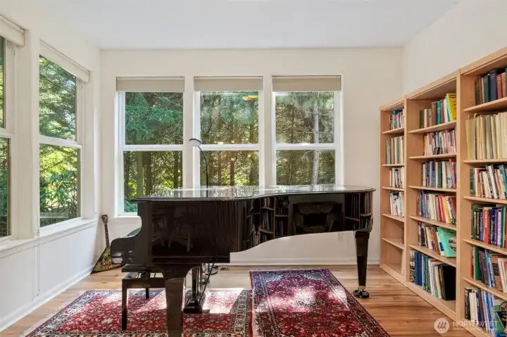 One of my favorite rooms in the whole house. Love the tall windows letting in all that light, merging the interior space with the outdoors. Currently a music room but could be a home office, gym, craft room etc.