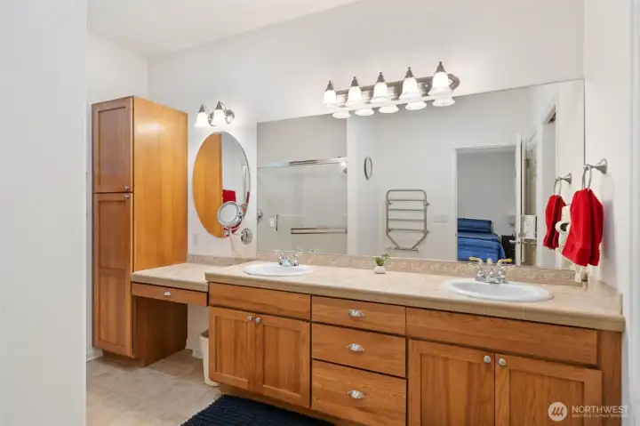 Primary bathroom with shower and double vanity.