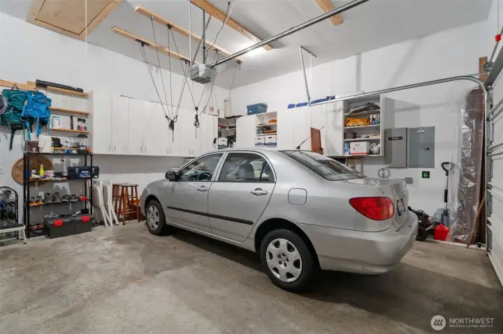 Spacious 2-car garage with lots of built-in cabinetry. Loft area provides tons of storage space. Spacious 2-car garage with lots of built-in cabinetry. Loft area provides tons of storage space.