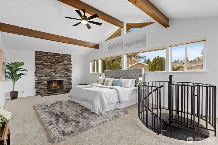 Primary bedroom w/ vaulted wood beam ceilings