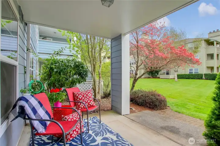 Back Patio faces open grassy area and landscaped grounds