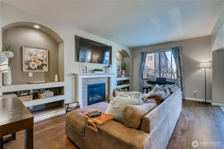 Family room with cozy gas fireplace and built ins on either side to display your treasures.