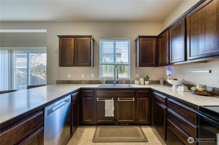 An abundance of cabinets and counter space in this well laid out kitchen.