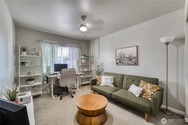 Additional bedroom upstairs, currently used as a home office and sitting room.