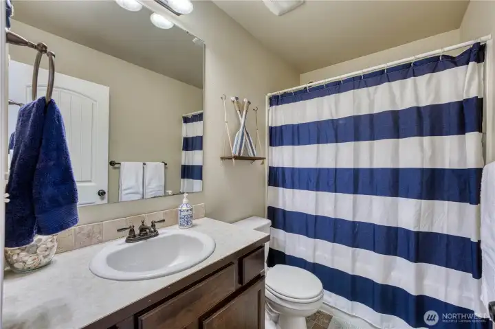 Upstairs spare bathroom is conveniently located near the additional bedrooms.