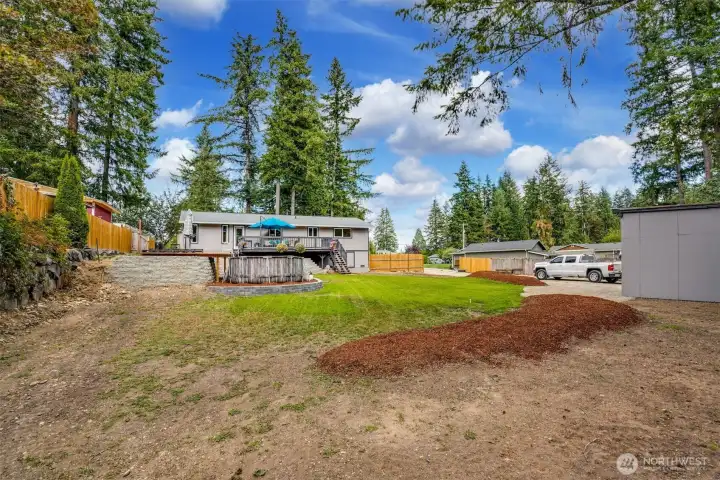 Huge lot with plenty of room for expansion. Both neighbors to the East use the extra space for detached garage or RV parking. Note width of the lot, driveway width with the huge site. City of Black Diamond has just epanded the site coverage up to 6,000 sqft. Check with the city of listing agent for details...