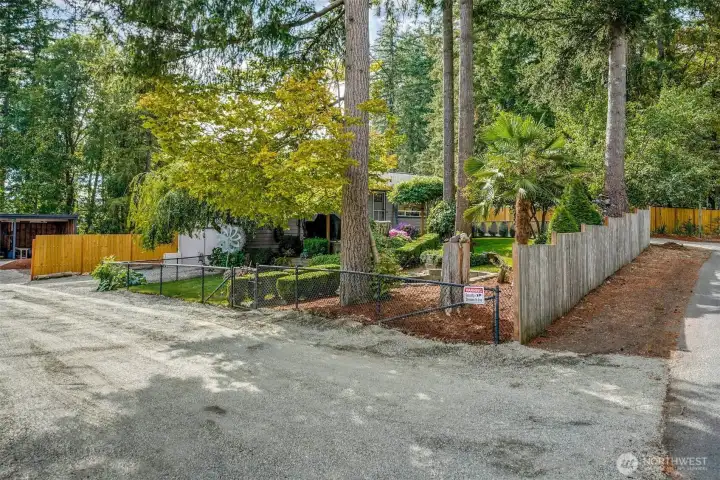Second driveway entry extra wide for future potential.