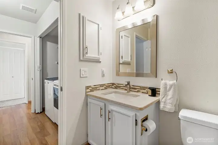 downstairs full bath across from downstairs bedroom