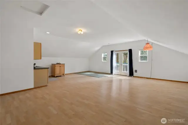 Upstairs is an amazing, versatile living space. It is 610 sq ft and features a bathroom and kitchenette.