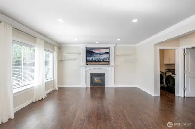 Living Room with fireplace and mounted TV