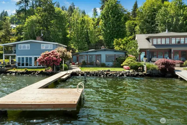 Charming mid-century modern home with 50 feet of prime waterfrontage on sought-after Rivieria Place!