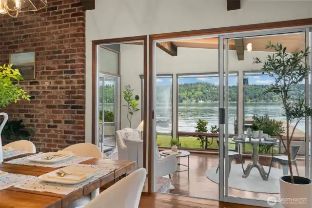Original lakeside patio was enclosed into a wonderful, light-filled sunroom with fireplace