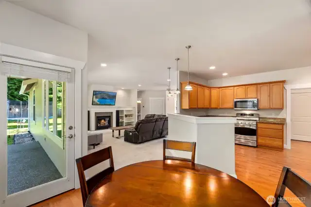Informal dining off of the kitchen with a glass door leading to the rear patio
