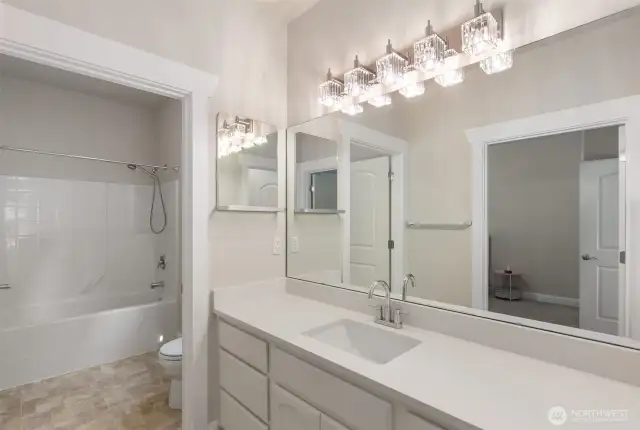 Great Jack and Jill bath with new quartz counters, undermount sink and fixtures