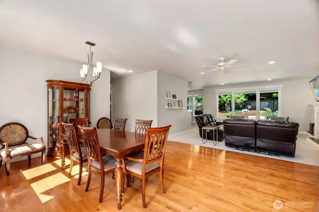 Wide open floor plan welcomes you with warm hardwood flooring in the generously sized dining room. Everything is light and bright.