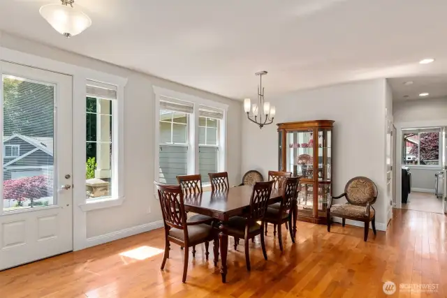 Plenty of space to entertain a crowd in this sunny dining room at the front of the home.