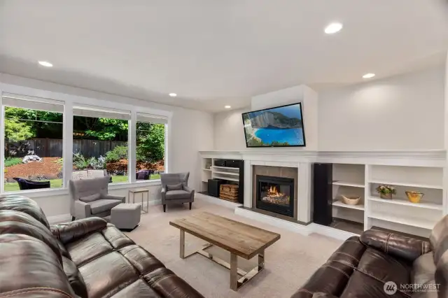 Built in shelving to house your books and A/V equipment surrounding a cozy gas fireplace