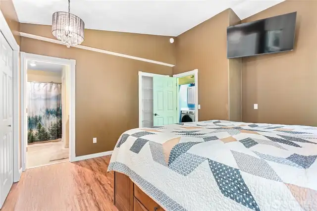 Primary bedroom with storage nook behind the door.  Private on-suite bathroom making this a serene space to relax in.