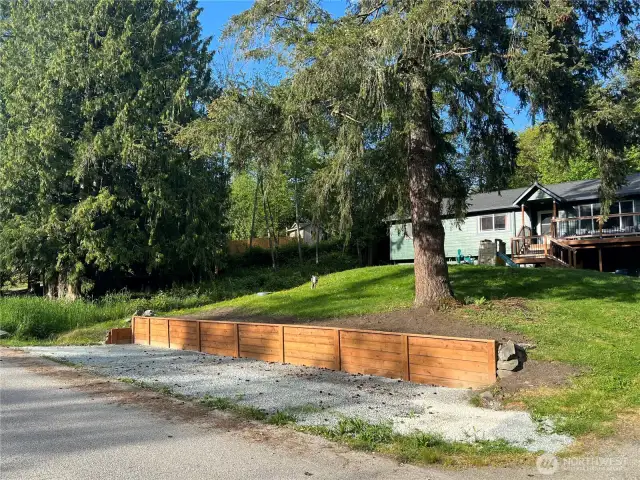 Nicely graveled space for extra car, camper, boat.  Great options with easy access.