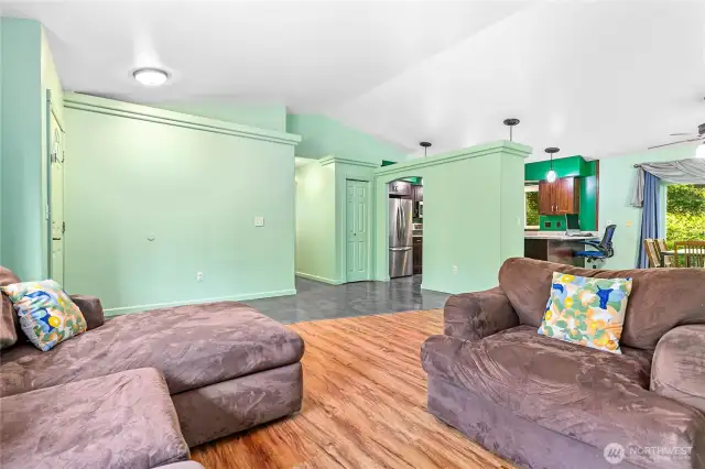 Living space is roomy yet cozy.  Vaulted ceilings and broad walls give an open feeling. The light coming in with a fabulous view of the nearby woodlands gives you a cabin feel.  The trees are out there but not so close to block the glorious sunshine.