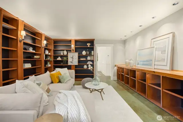 The charming library/ study acts as an extension of the primary suite, and separates the sleeping area from the rest of the house. This room could serve as an office, media room, or dressing room as well.