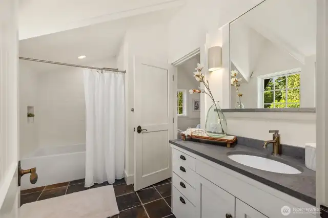 The upstairs full bath can be accessed from the 2nd bedroom or the upstairs hallway.