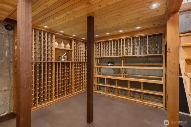 Tucked off the living room, just outside the kitchen, a stairway leads to this enormous wine cellar and root cellar. The cedar in this room was milled from trees felled on the property. You’ll find both wine racks and storage for root veggies and/or your home-canned goods (see virtual tour).