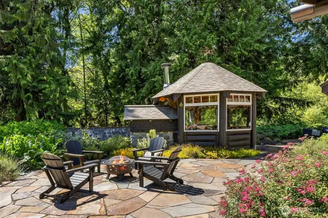 On the opposite side of the pizza gazebo lies even more gorgeous patio space for entertaining, or just for admiring the grounds. It offers views of the front yard, berry patch, chicken coop, strawberry beds, and herb gardens.