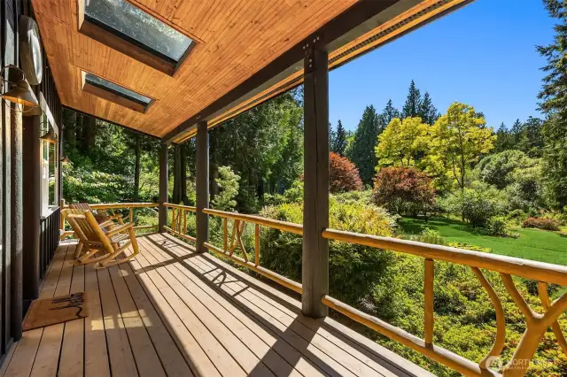 This delightful covered front deck offers light through two large skylights as well as shelter from sun or rain. The views of the meadow, orchard, pond, and forest are so absolutely enchanting that your guests may never want to leave!