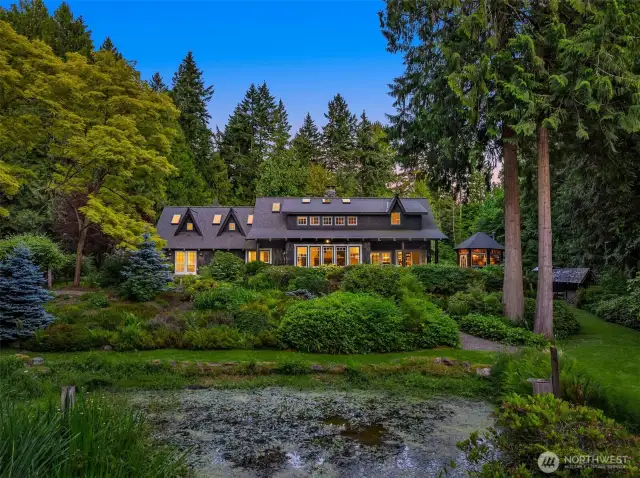 One final look at this gorgeous country home, as seen from the meadow on the far side of the pond. Truly enchanting!