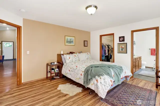 The primary suite includes a large walk in closet and attached en suite.